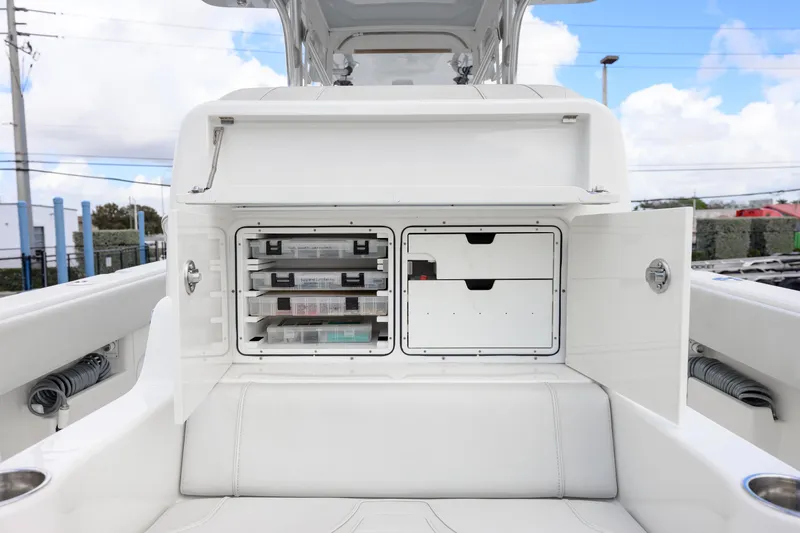 Seavee Yacht Photos Pics 2021 SeaVee 322Z boat storage compartments with organized tackle boxes and drawers.