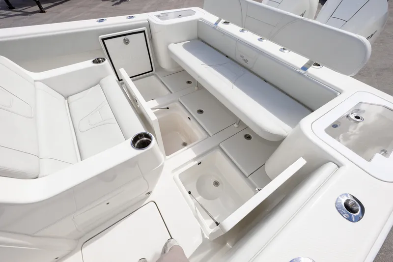Seavee Yacht Photos Pics 2021 SeaVee 322Z boat interior with white seating and storage compartments.