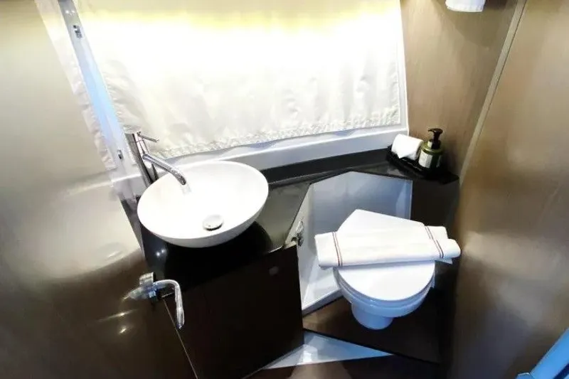  Yacht Photos Pics 2025 Jeanneau Merry Fisher 1095 bathroom with modern sink and toilet.