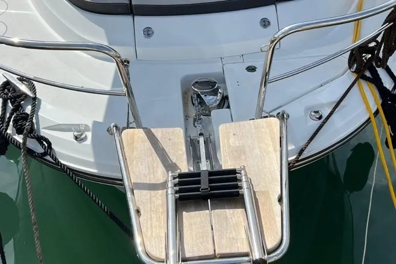  Yacht Photos Pics Stern view of 2025 Jeanneau Merry Fisher 1095 with swim platform and ladder.