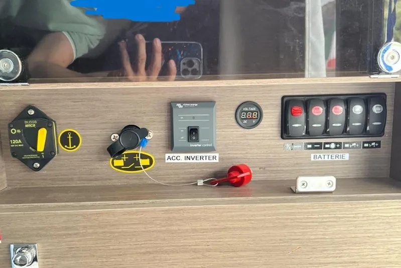  Yacht Photos Pics Control panel of 2025 Jeanneau Merry Fisher 1095 boat with switches and voltage display.