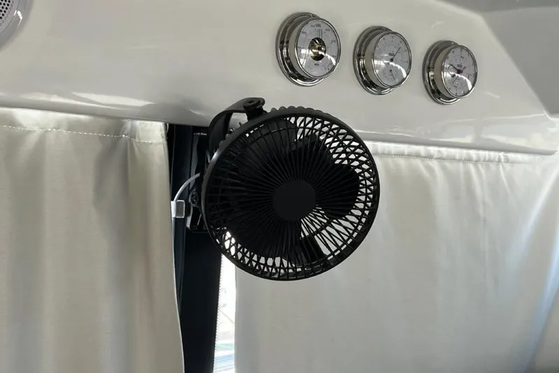  Yacht Photos Pics Interior of 2025 Jeanneau Merry Fisher 1095 with fan and gauges.