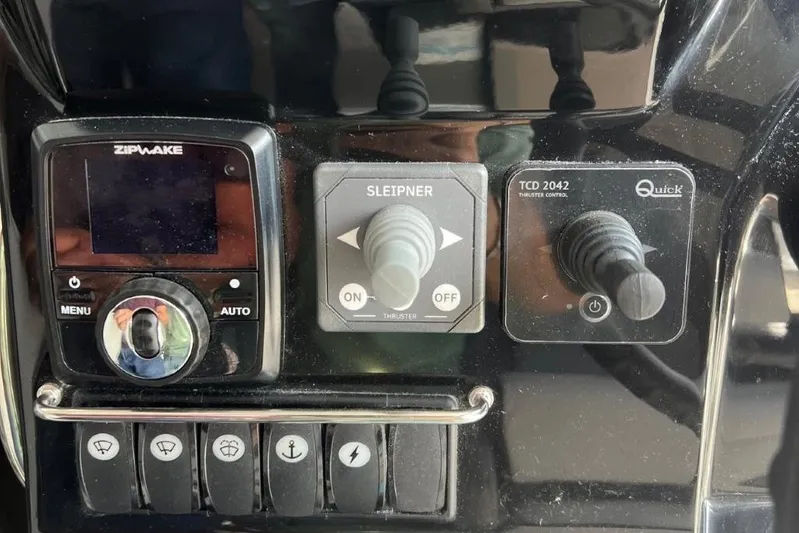  Yacht Photos Pics Control panel of 2025 Jeanneau Merry Fisher 1095 boat with various switches and dials.