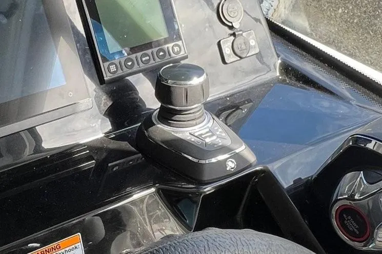  Yacht Photos Pics Control panel of 2025 Jeanneau Merry Fisher 1095 boat with joystick and display.