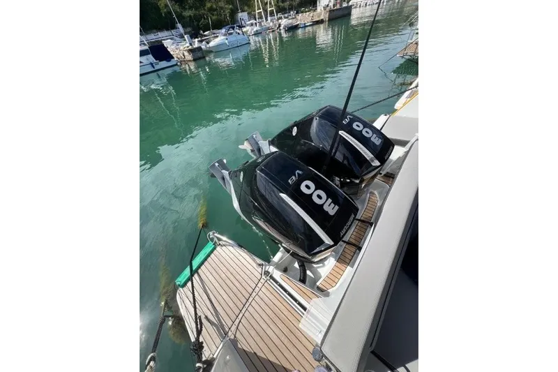  Yacht Photos Pics 2025 Jeanneau Merry Fisher 1095 with twin outboard engines docked at marina.