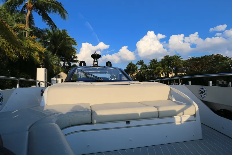 Sapore Di Mare Yacht Photos Pics Luxurious 2022 Azimut 47 VERVE yacht with plush seating, set against a tropical backdrop.