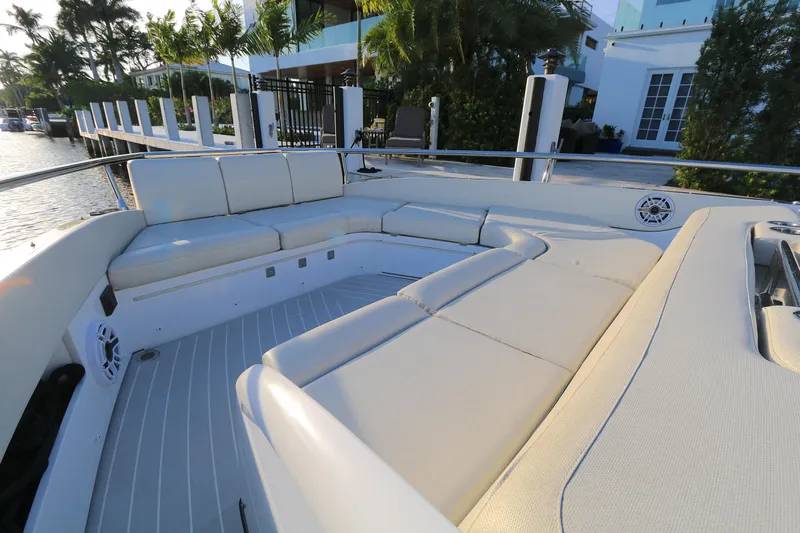 Sapore Di Mare Yacht Photos Pics Luxurious seating area on 2022 Azimut 47 VERVE yacht, docked by waterfront property.