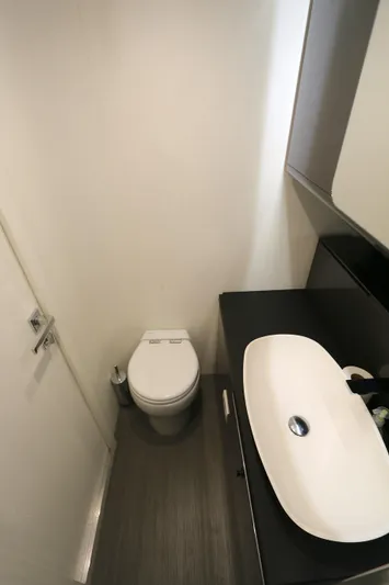 Sapore Di Mare Yacht Photos Pics Modern bathroom interior in 2022 Azimut 47 VERVE yacht, featuring sleek sink and toilet.