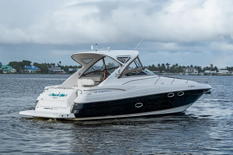  Yacht Photos Pics 2008 Regal Commodore 3760 IB cruising on a calm lake.