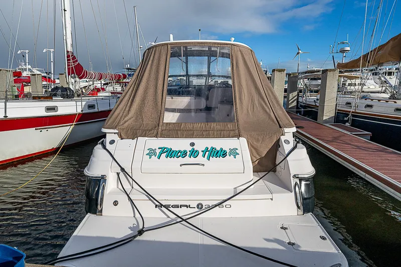  Yacht Photos Pics 2008 Regal Commodore 3760 IB boat docked at marina, rear view with canopy.