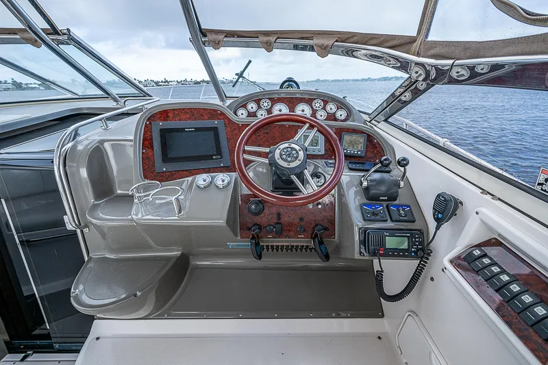  Yacht Photos Pics 2008 Regal Commodore 3760 IB boat cockpit with steering wheel and navigation controls.