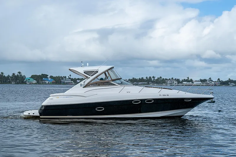  Yacht Photos Pics 2008 Regal Commodore 3760 IB yacht on calm water under cloudy sky.