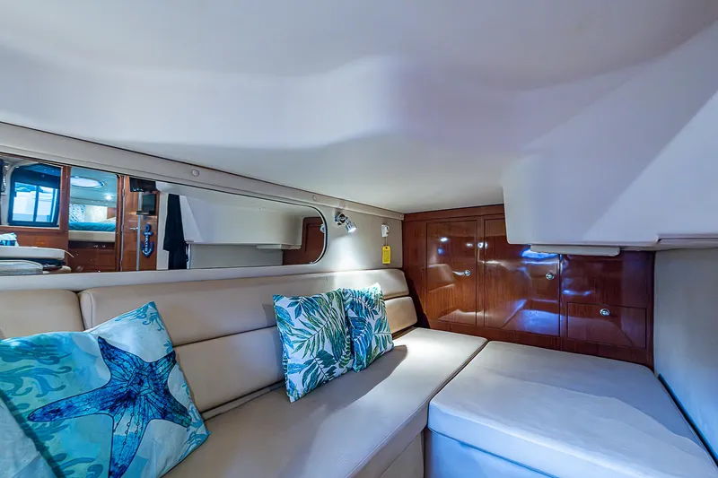  Yacht Photos Pics Interior of 2008 Regal Commodore 3760 IB yacht with plush seating and decorative pillows.