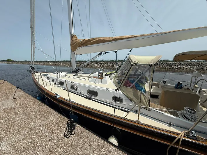 Chapter 9 Yacht Photos Pics Sailboat Tartan 4000, 2012 model, docked at a marina on a sunny day.