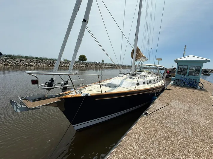 Chapter 9 Yacht Photos Pics Sailboat Tartan 4000, 2012 model, docked at marina with clear sky.