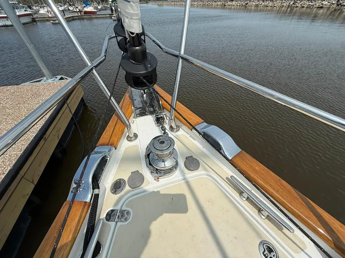 Chapter 9 Yacht Photos Pics Bow of 2012 Tartan 4000 sailboat docked, featuring deck details and winch.