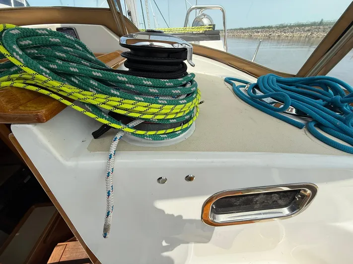 Chapter 9 Yacht Photos Pics Sailboat deck with colorful ropes and winch, Tartan 4000, 2012 model.