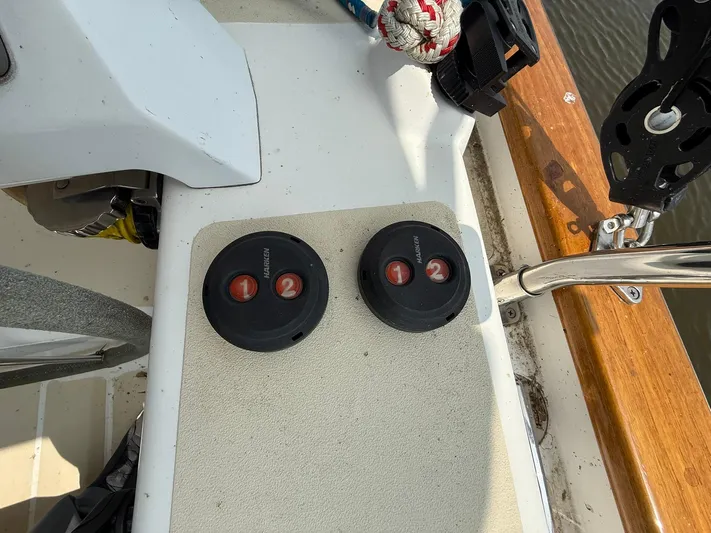 Chapter 9 Yacht Photos Pics Control panel on a 2012 Tartan 4000 sailboat deck with two circular switches.