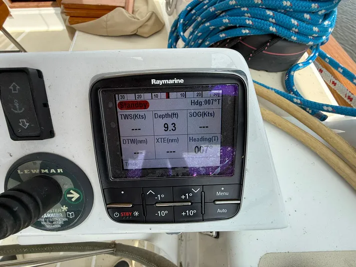 Chapter 9 Yacht Photos Pics Raymarine navigation display on Tartan 4000 yacht, showing depth and heading, with ropes in the background.