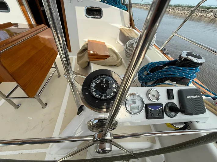 Chapter 9 Yacht Photos Pics Cockpit of 2012 Tartan 4000 sailboat with compass, navigation instruments, and ropes.