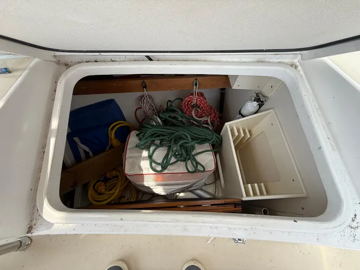 Chapter 9 Yacht Photos Pics Storage compartment on a 2012 Tartan 4000 boat with ropes and equipment.