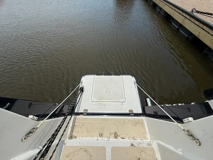 Chapter 9 Yacht Photos Pics Tartan 4000 sailboat stern view, docked, showcasing deck and water, 2012 model.