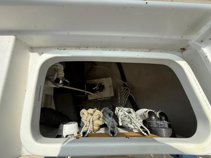 Chapter 9 Yacht Photos Pics Storage compartment on a 2012 Tartan 4000 sailboat with ropes and equipment.