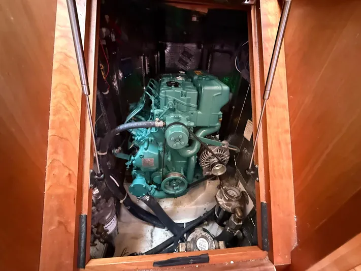 Chapter 9 Yacht Photos Pics Engine compartment of a 2012 Tartan 4000 sailboat, showcasing a green marine engine.