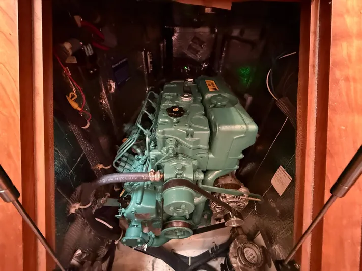 Chapter 9 Yacht Photos Pics Engine compartment of a 2012 Tartan 4000 sailboat, showcasing a well-maintained marine engine.