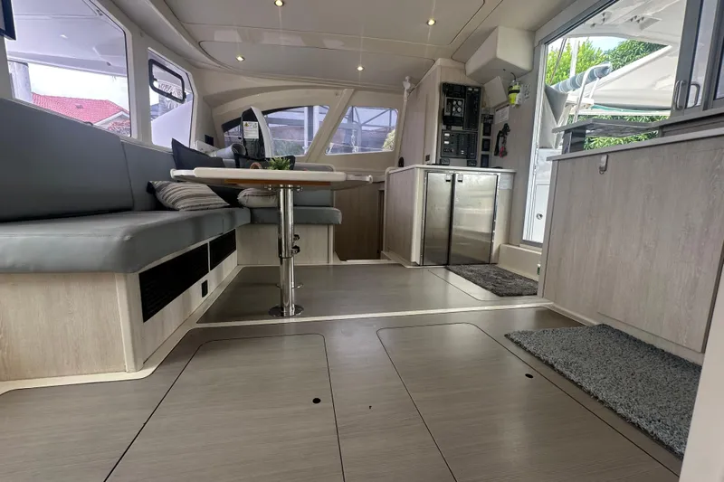 Ohana Yacht Photos Pics Interior of 2016 Leopard 44 catamaran with modern seating and sleek kitchen area.