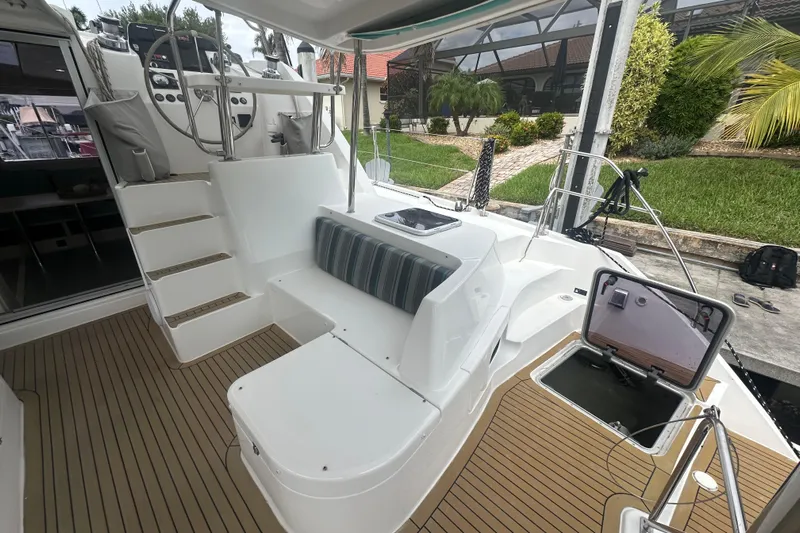 Ohana Yacht Photos Pics Leopard 44 catamaran cockpit with seating, helm, and open hatch, 2016 model.