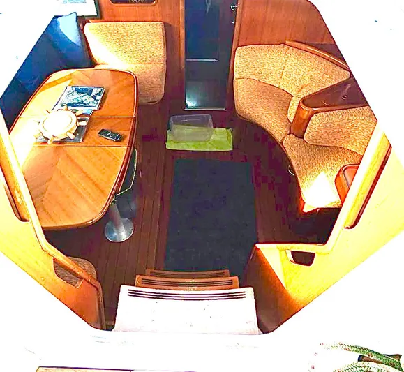 Princessa Yacht Photos Pics Interior of 2000 Beneteau 44 Center Cockpit with dining area and seating.