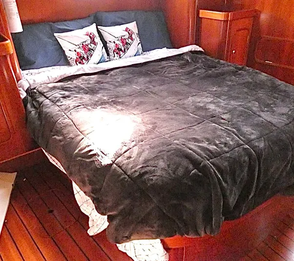 Princessa Yacht Photos Pics Luxurious cabin interior of 2000 Beneteau 44 Center Cockpit with cozy bedding.