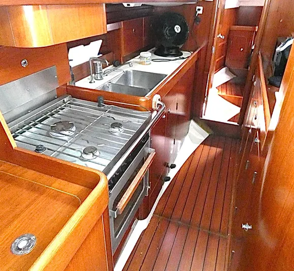 Princessa Yacht Photos Pics Interior of 2000 Beneteau 44 Center Cockpit yacht with wooden cabinetry and kitchen amenities.