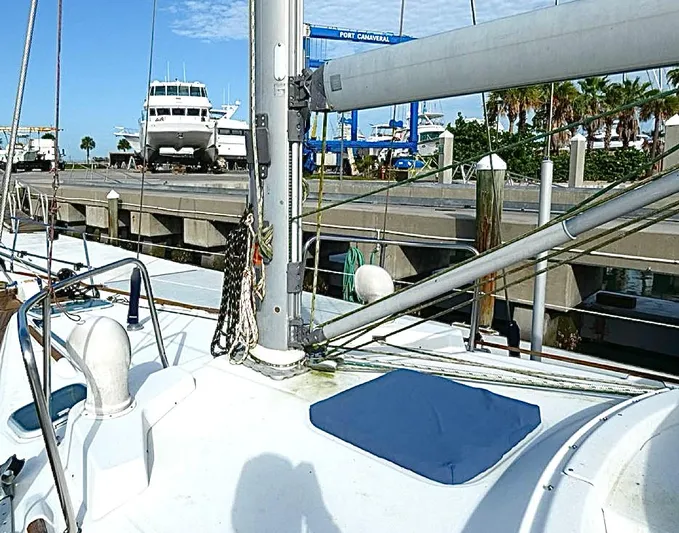 Princessa Yacht Photos Pics Beneteau 44 Center Cockpit sailboat docked at marina, 2000 model, with clear sky background.