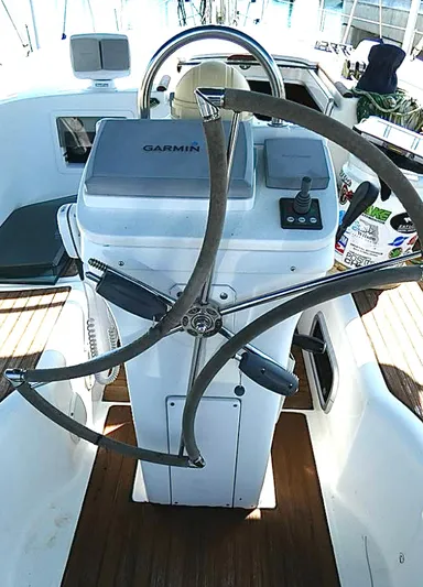 Princessa Yacht Photos Pics Steering wheel and controls of a 2000 Beneteau 44 Center Cockpit sailboat.