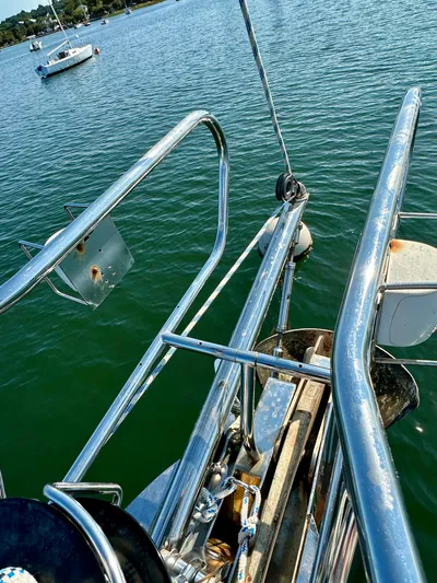 Après Yacht Photos Pics Bow of 2010 Beneteau 57 sailboat with stainless steel railings on calm water.