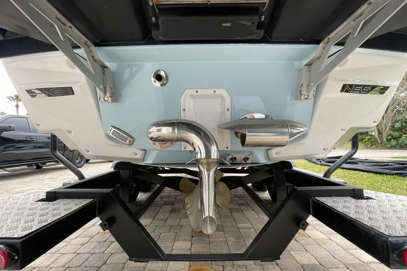 Motivated Yacht Photos Pics 2025 Nautique Super Air Nautique G23 Paragon boat trailer view, showcasing NSS system.