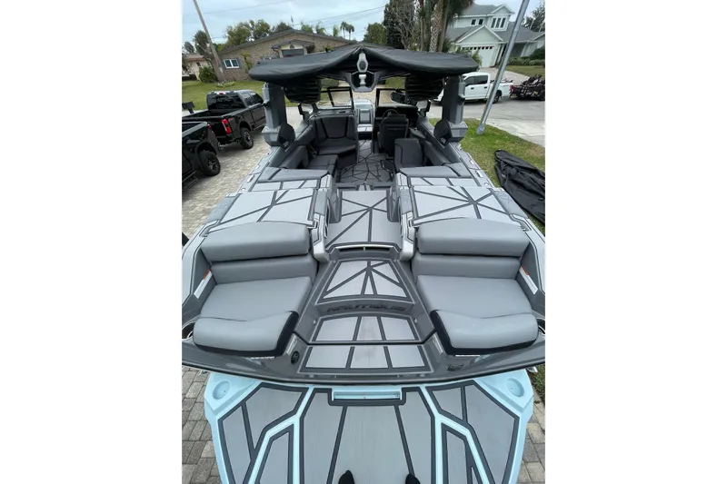 Motivated Yacht Photos Pics 2025 Nautique Super Air Nautique G23 Paragon boat with sleek gray seating and modern design.