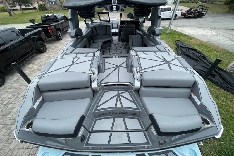 Motivated Yacht Photos Pics 2025 Nautique Super Air Nautique G23 Paragon boat interior with luxurious seating and modern design.