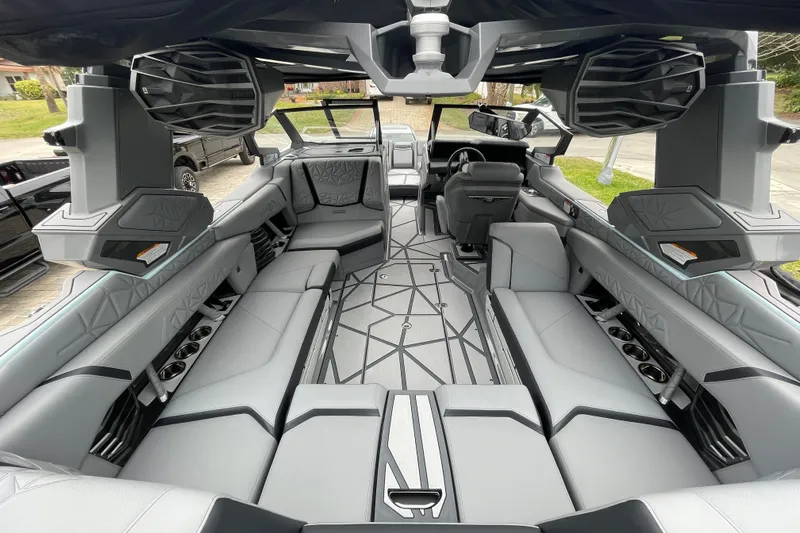 Motivated Yacht Photos Pics Luxurious interior of 2025 Nautique Super Air Nautique G23 Paragon boat, featuring sleek seating and modern design.