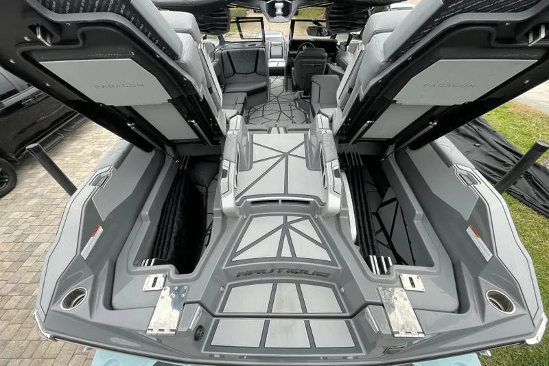 Motivated Yacht Photos Pics 2025 Nautique Super Air Nautique G23 Paragon interior with open storage compartments.