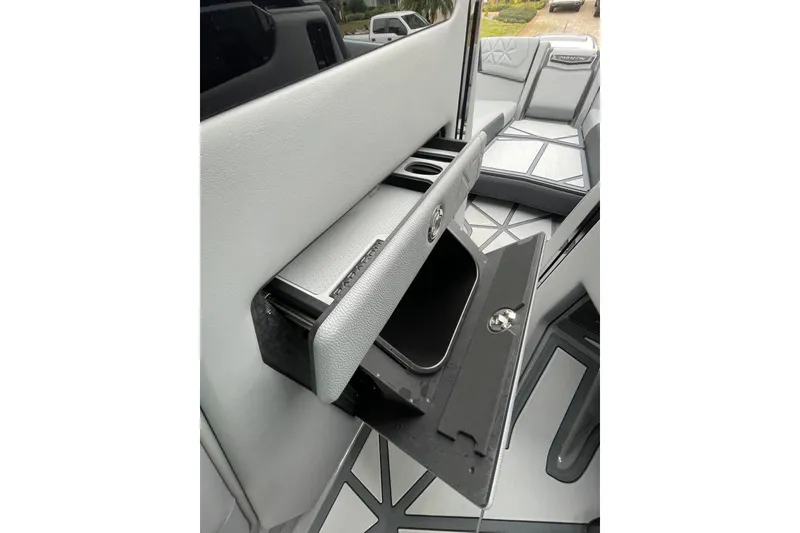 Motivated Yacht Photos Pics 2025 Nautique Super Air Nautique G23 Paragon interior storage compartment detail.