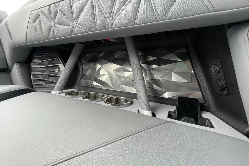 Motivated Yacht Photos Pics Interior of 2025 Nautique Super Air Nautique G23 Paragon with geometric design and cup holders.