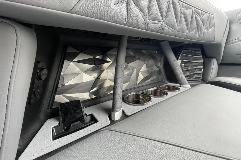 Motivated Yacht Photos Pics 2025 Nautique Super Air Nautique G23 Paragon interior with geometric design and cup holders.