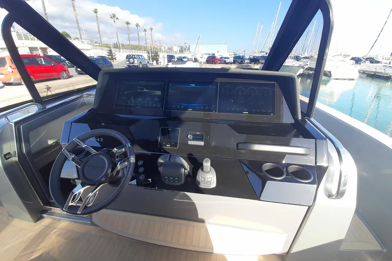 Yacht Photos Pics 2026 Pardo Yachts 43 helm with modern controls and digital displays at marina.