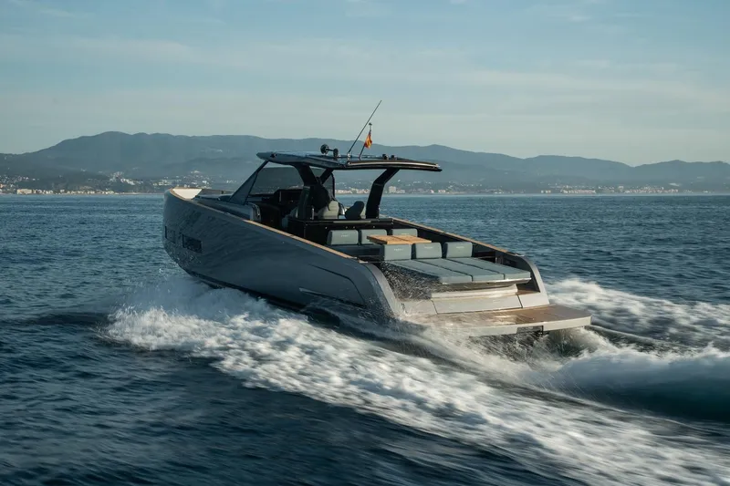  Yacht Photos Pics 2026 Pardo Yachts 43 cruising on open water with scenic mountain backdrop.