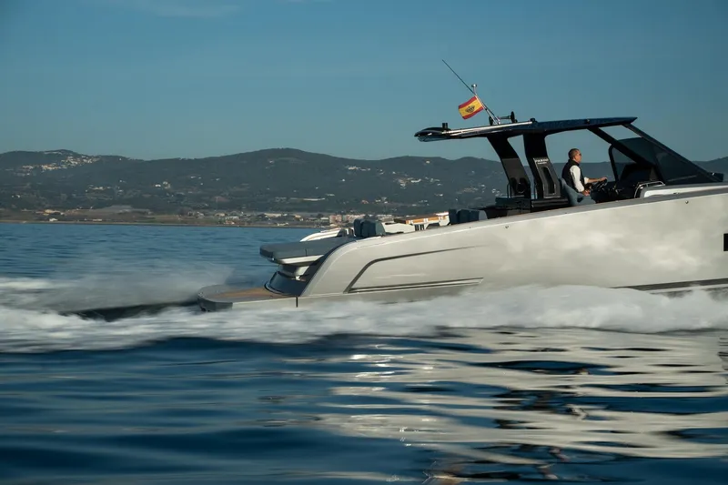  Yacht Photos Pics 2026 Pardo Yachts 43 cruising on calm waters with scenic mountain backdrop.