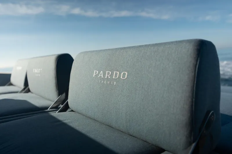  Yacht Photos Pics 2026 Pardo Yachts 43, luxurious seating detail with embroidered logo, ocean backdrop.