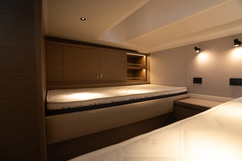 Yacht Photos Pics Luxurious interior cabin of 2026 Pardo Yachts 43 with modern lighting and wooden finishes.